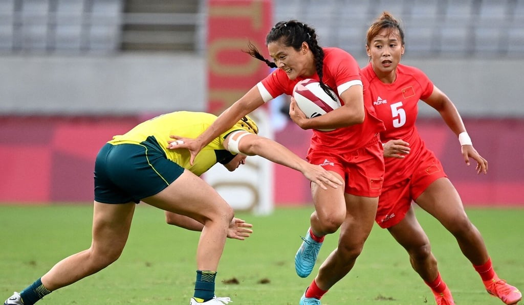 China’s Wang Wanyu evades a tackle in a women’s pool C rugby sevens match against Australia at the Tokyo 2020 Olympic Games. Photo: AFP