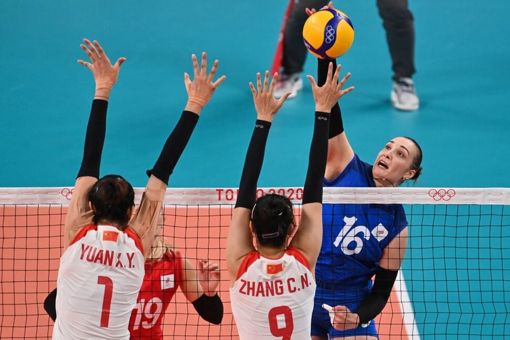 Russia's Irina Voronkova hits the ball at the net against China. Photo: AFP