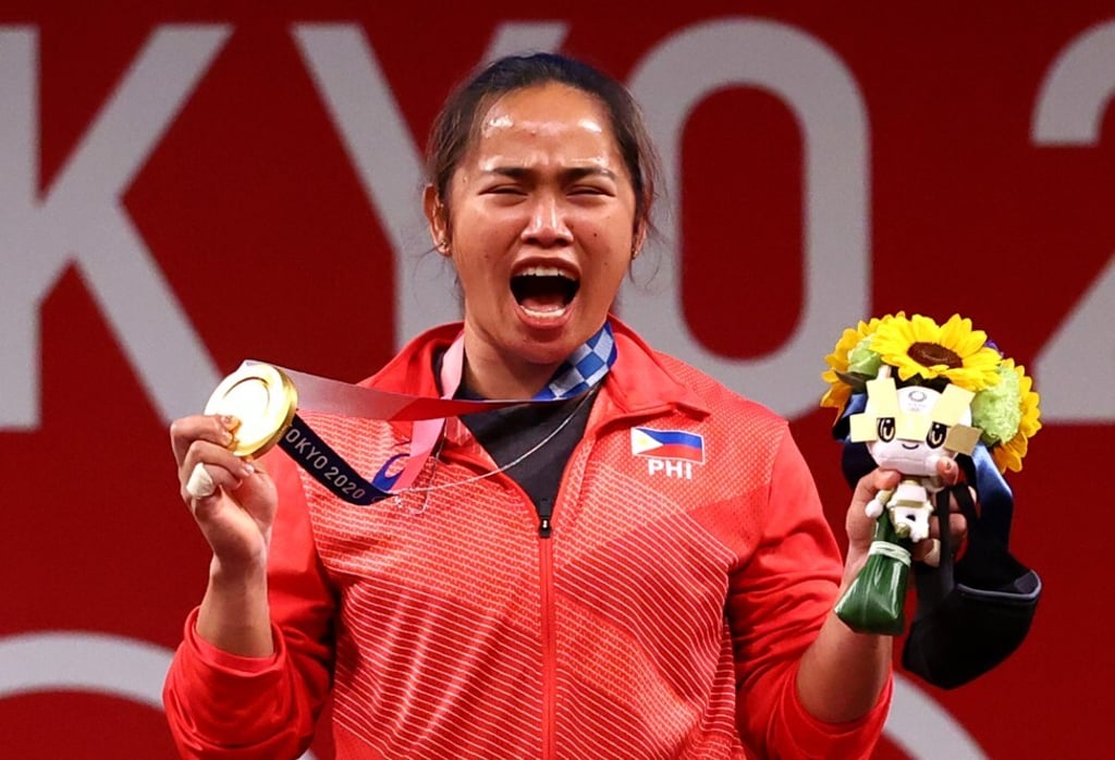Hidilyn Diaz celebrates with her gold medal. Photo: Reuters Hidilyn Diaz celebrates with her gold medal. Photo: Reuters