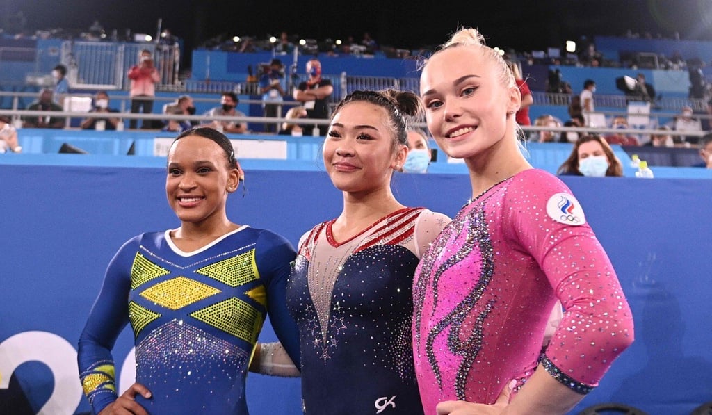 US gold medallist Sunisa Lee (centre) with Brazilian Rebeca Andrade and Russian Angelina Melnikova after the artistic gymnastics women's all-around final. Photo: AFP