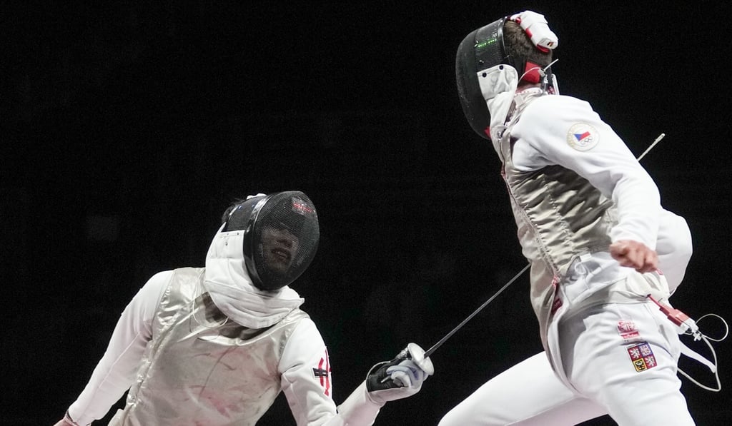 Edgar Cheung (left) competes in the fencing semi-finals at the Tokyo Olympic Games. Photo: AP Edgar Cheung (left) competes in the fencing semi-finals at the Tokyo Olympic Games. Photo: AP