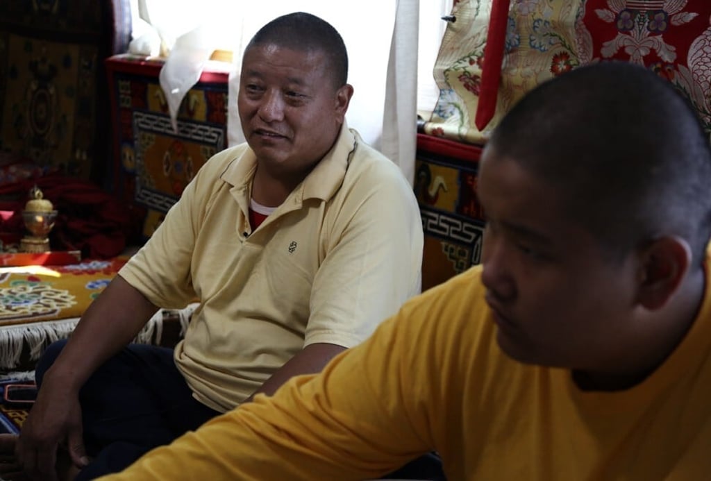 Dorje Tsegyal teaches his son Jalue Dorje, right, about Tibetan culture, language and religious studies as he prepares for life as a monk and Buddhist lama. Photo: AP