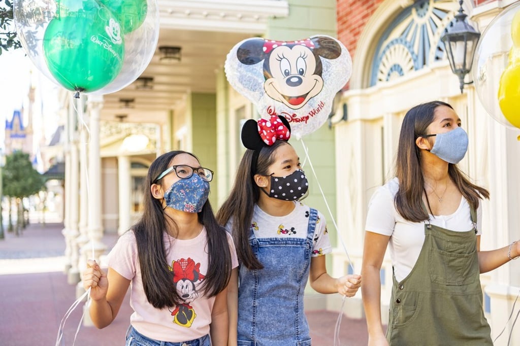 Guests wear masks at Walt Disney World Resort in Florida. Photo: Walt Disney World Resort / Getty Images / TNS