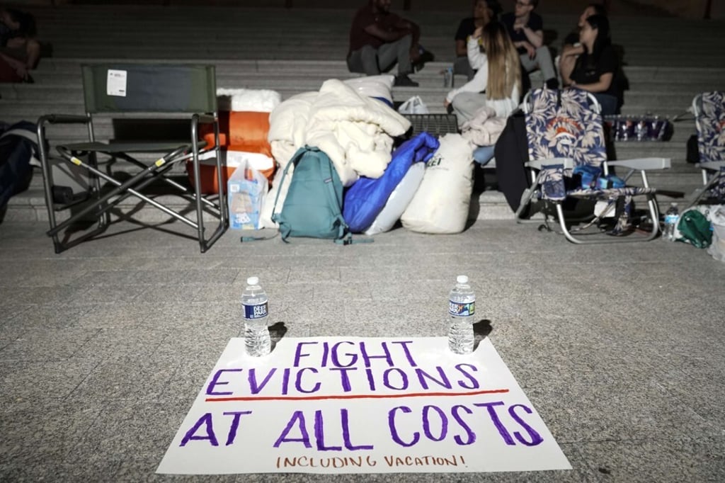 A sign calling for fighting evictions is set on the ground as Cori Bush spends the night outside the US Capitol in Washington on Saturday. Photo: Getty Images / AFP A sign calling for fighting evictions is set on the ground as Cori Bush spends the night outside the US Capitol in Washington on Saturday. Photo: Getty Images / AFP