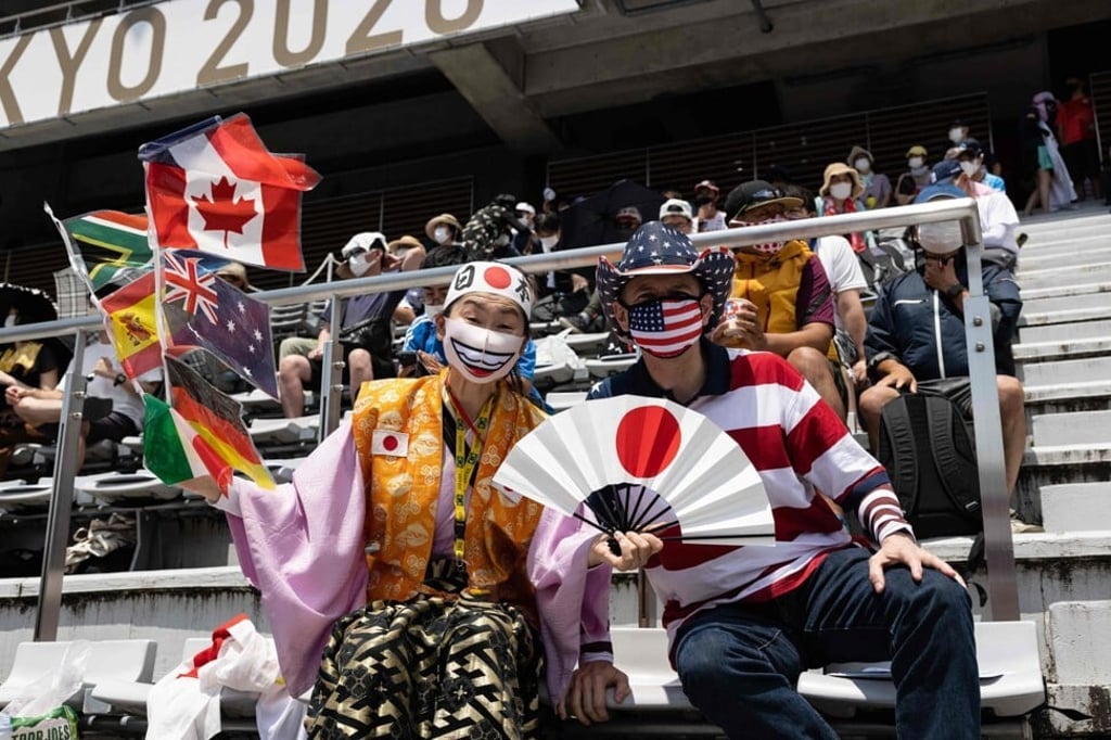 Kyoko Ishikawa and her husband John Sledge in the spectator stands of the Fuji International Speedway in Shizuoka, Japan. Photo: AFP