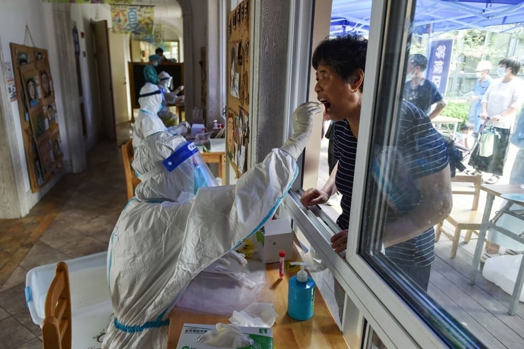 A man receives a nucleic acid test for Covid-19 in Nanjing, capital of eastern China's Jiangsu province, on August 2, 2021, as the country experiences its most widespread coronavirus outbreak in months. Photo: Agence France-Presse