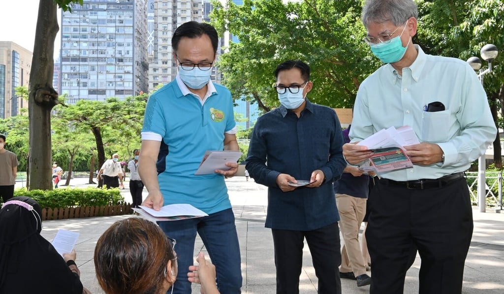 Civil service chief Patrick Nip (leftmost) and Secretary for Labour and Welfare Dr Law Chi-kwong (extreme right) distribute leaflets at Victoria Park. Photo: Handout Civil service chief Patrick Nip (leftmost) and Secretary for Labour and Welfare Dr Law Chi-kwong (extreme right) distribute leaflets at Victoria Park. Photo: Handout