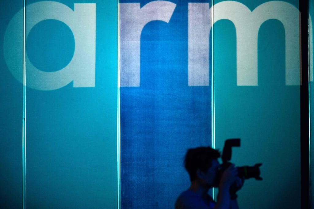 A photographer taking pictures in front of the logo for British chip designer Arm in Taipei on May 27, 2019. Photo: AFP A photographer taking pictures in front of the logo for British chip designer Arm in Taipei on May 27, 2019. Photo: AFP