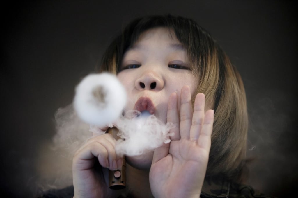 A saleswoman demonstrates vaping at the Vape Shop that sells e-cigarette products in Beijing in January 2019. Photo: Reuters A saleswoman demonstrates vaping at the Vape Shop that sells e-cigarette products in Beijing in January 2019. Photo: Reuters