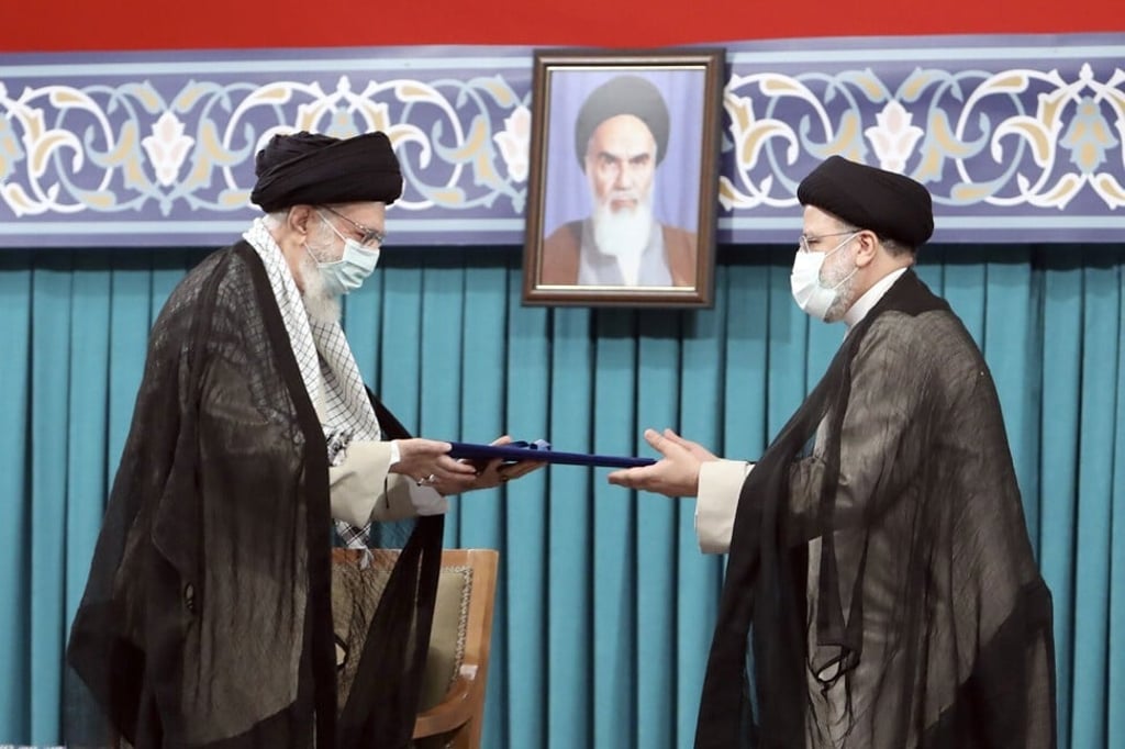 Iran’s Supreme Leader Ayatollah Ali Khamenei, left, gives his official seal of approval to newly elected President Ebrahim Raisi on August 3, 2021. Photo: AP