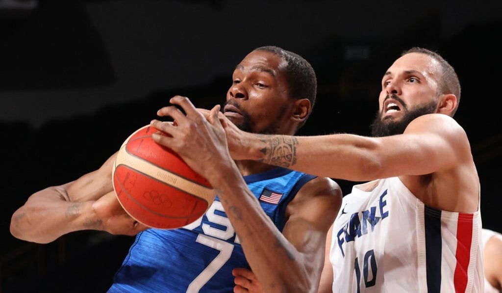 Team France shooting guard Evan Fournier knocks the ball from Team United States forward Kevin Durant. Photo: TNS