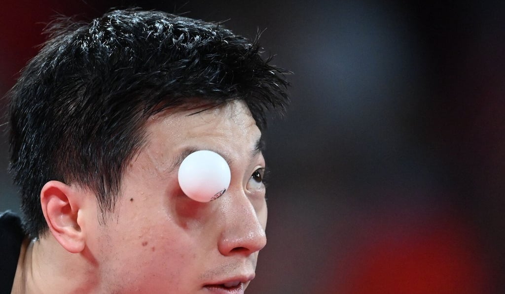 Ma Long serves to Germany’s Timo Boll during their men’s team final table tennis match at the Tokyo Metropolitan Gymnasium. Photo: AFP Ma Long serves to Germany’s Timo Boll during their men’s team final table tennis match at the Tokyo Metropolitan Gymnasium. Photo: AFP
