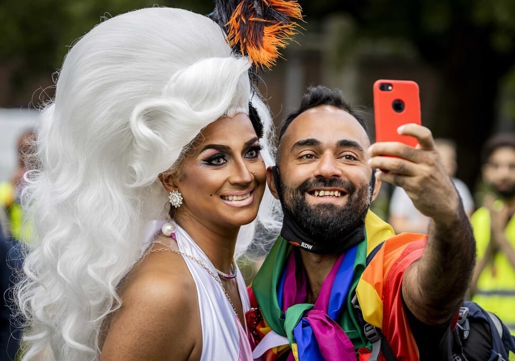 Participants pose for a selfie during the Pride Walk in Amsterdam on Saturday. Photo: EPA-EFE