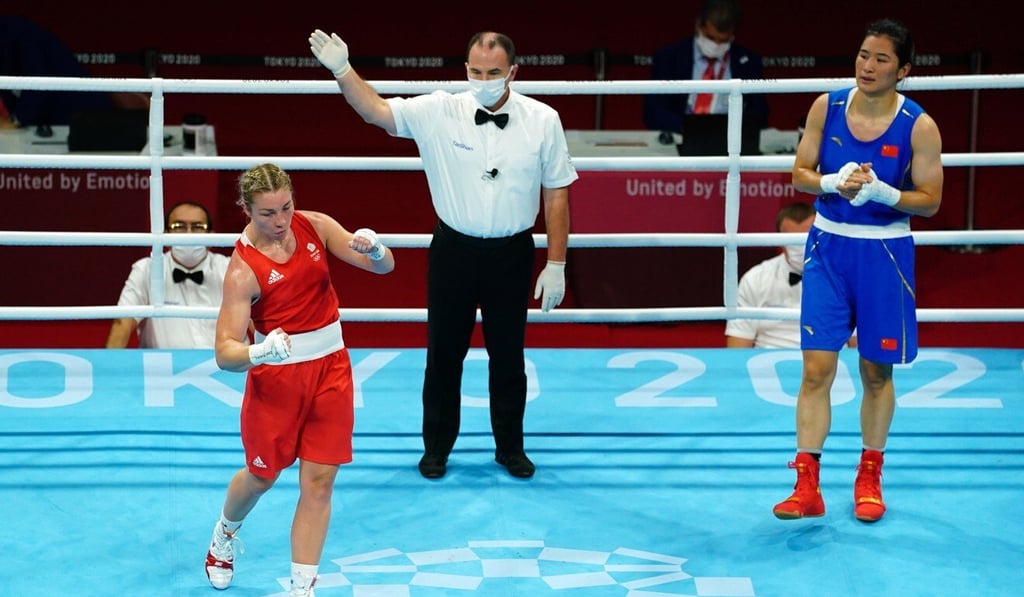 Great Britain’s Lauren Price (left) celebrates after beating China's Qian Li in the Tokyo 2020 Olympic Games women's middleweight boxing final at the Kokugikan Arena in Tokyo in August. Photo: DPA Great Britain’s Lauren Price (left) celebrates after beating China's Qian Li in the Tokyo 2020 Olympic Games women's middleweight boxing final at the Kokugikan Arena in Tokyo in August. Photo: DPA