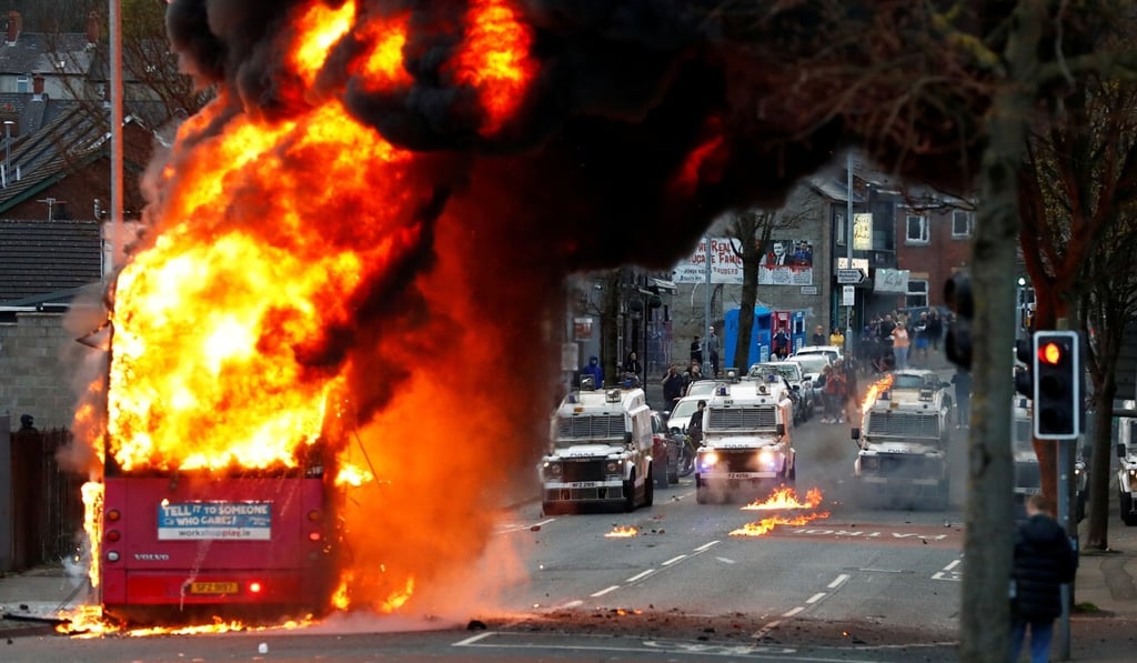 A burning bus is seen amid protests in Belfast earlier this year. Downing Street reportedly bought the US$138,700 in artworks to mark the centenary of the foundation of Northern Ireland. Photo: Reuters A burning bus is seen amid protests in Belfast earlier this year. Downing Street reportedly bought the US$138,700 in artworks to mark the centenary of the foundation of Northern Ireland. Photo: Reuters