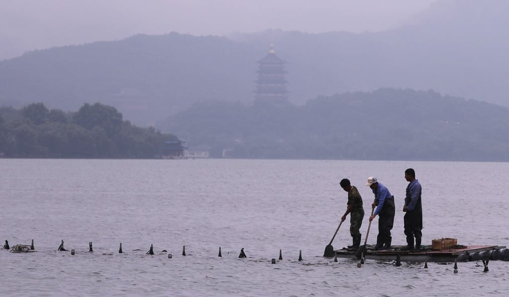 Workers adjust the musical fountain on West Lake, Hangzhou. West Lake is listed as a world cultural heritage site. Photo: Simon Song Workers adjust the musical fountain on West Lake, Hangzhou. West Lake is listed as a world cultural heritage site. Photo: Simon Song