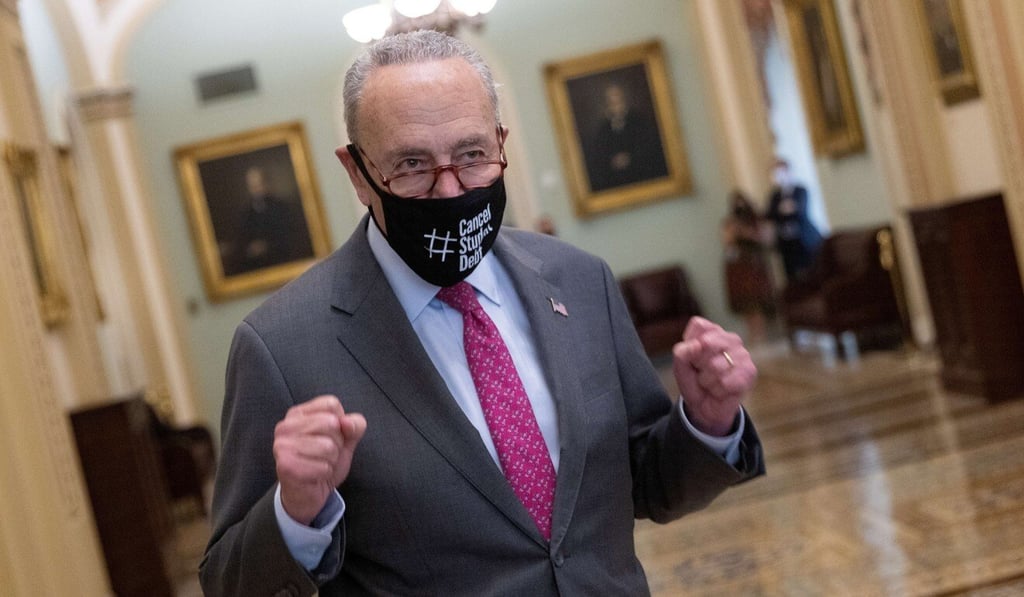US Senate Majority Leader Chuck Schumer emerges from the Senate chamber after final passage of the US$1.2 trillion infrastructure bill on Tuesday. Photo: AFP US Senate Majority Leader Chuck Schumer emerges from the Senate chamber after final passage of the US$1.2 trillion infrastructure bill on Tuesday. Photo: AFP