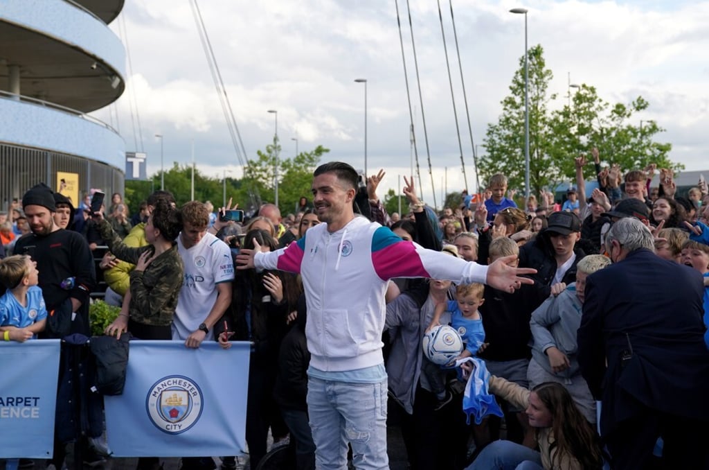 Jack Grealish greets Manchester City fans outside after a press conference at the Etihad Stadium. Photo: DPA Jack Grealish greets Manchester City fans outside after a press conference at the Etihad Stadium. Photo: DPA