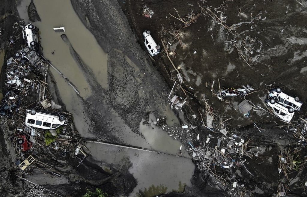 An aerial view of overturned cars on a mud-covered street in Bozkurt, Kastamonu province, Turkey on Saturday. Photo: IHA via AP
