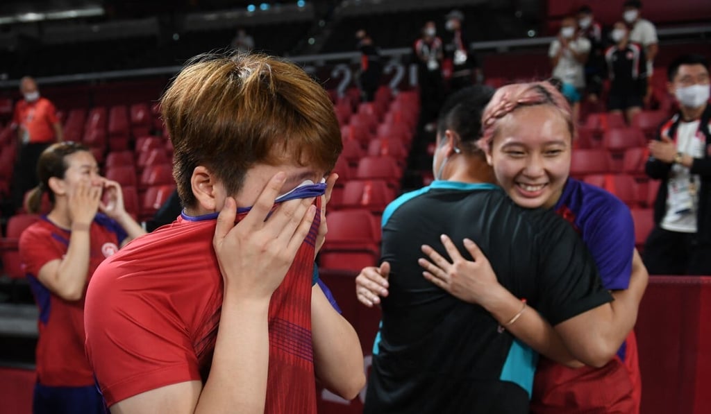 Hong Kong's Lee Ho-ching, Doo Hoi-kem and Minnie Soo Wai-yam (from left) celebrate after winning the women's team table tennis bronze medal match against Germany at the Tokyo 2020 Olympic Games. Photo: AFP Hong Kong's Lee Ho-ching, Doo Hoi-kem and Minnie Soo Wai-yam (from left) celebrate after winning the women's team table tennis bronze medal match against Germany at the Tokyo 2020 Olympic Games. Photo: AFP