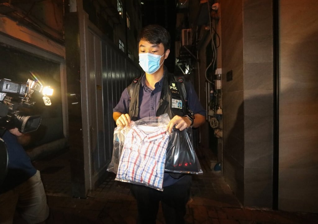 Clothes worn at the time of the alleged offence are gathered by officers. Photo: Handout Clothes worn at the time of the alleged offence are gathered by officers. Photo: Handout