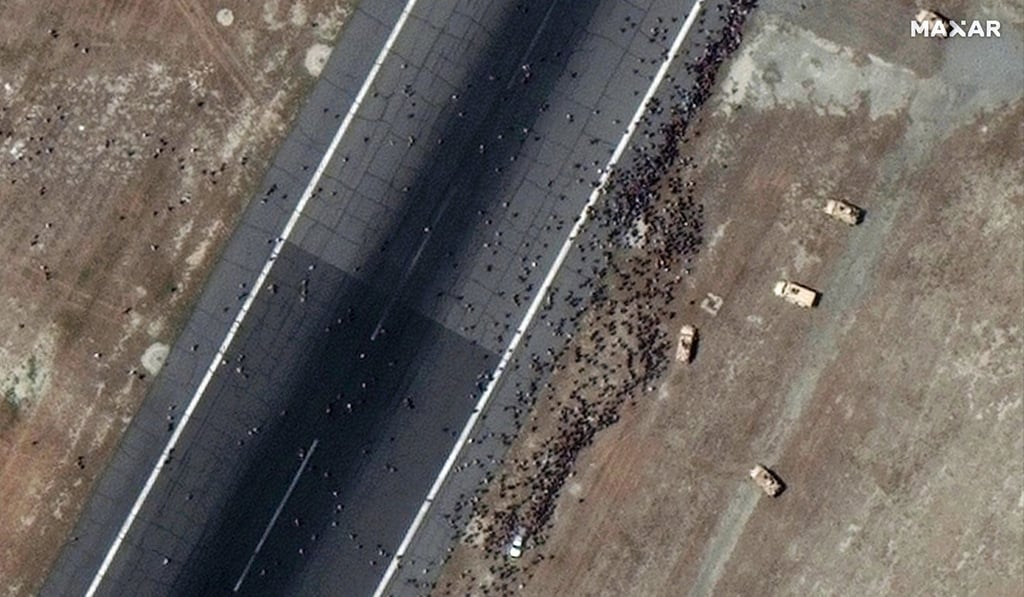 People congregating on a runway at Kabul’s airport on Monday. Photo: 2021 Maxar Technologies People congregating on a runway at Kabul’s airport on Monday. Photo: 2021 Maxar Technologies