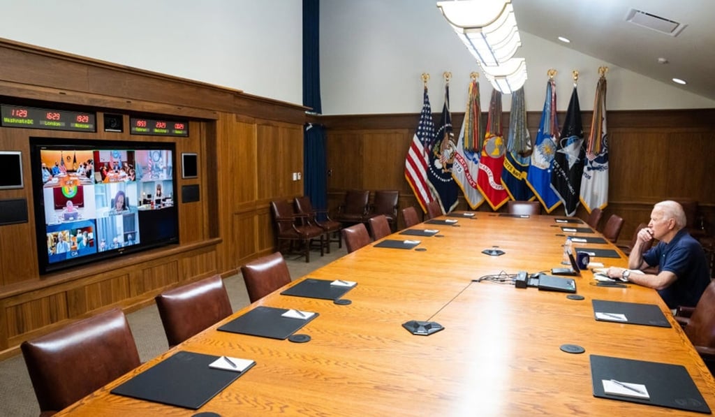 The White House released this photo of President Joe Biden at Camp David, staring pensively at officials on a monitor, surrounded by empty seats. Photo: Reuters