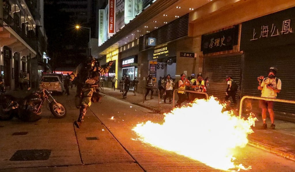 Protesters hurl petrol bombs at riot police on Mallory Street in Wan Chai, on November 2, 2019. Photo: Felix Wong