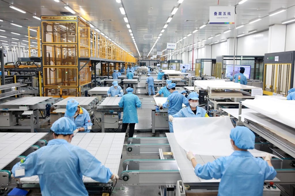 Employees assembling photovoltaic solar panels at a factory of Risen Energy in Ningbo in Zhejiang province on February 21, 2019. Photo: Reuters