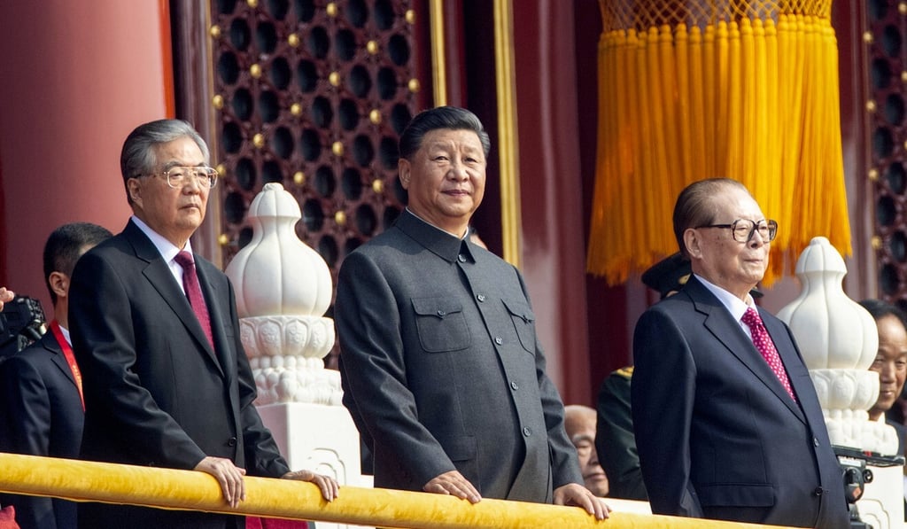 President Xi Jinping (centre), along with predecessors Hu Jintao (left) and Jiang Zemin, watches celebrations to commemorate the 70th anniversary of the founding of the People’s Republic of China, in Beijing on October 1, 2019. Photo: AP