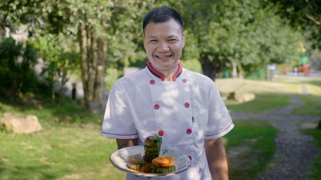 Zhu with his signature stuffed chayote dish, which is a popular item on the menu at Xueshan Linyuan Agritainment restaurant.