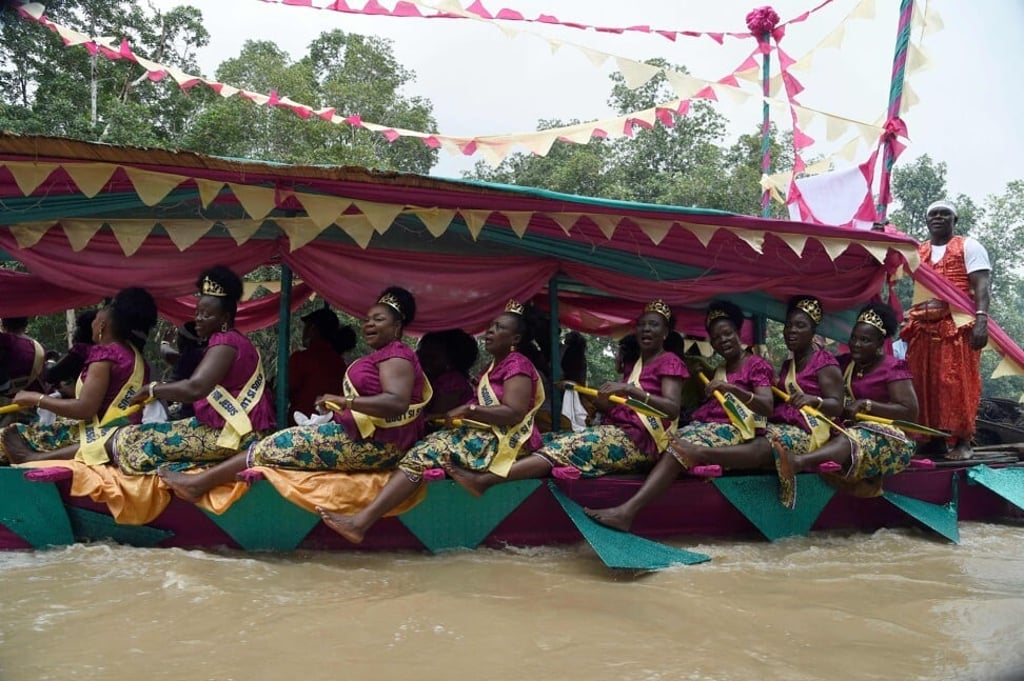 Women dance in a regatta to mark the coronation of Prince Omo Oba Utienyinoritsetsola Emiko at Ode Itsekiri, Nigeria on Saturday. Photo: AFP Women dance in a regatta to mark the coronation of Prince Omo Oba Utienyinoritsetsola Emiko at Ode Itsekiri, Nigeria on Saturday. Photo: AFP