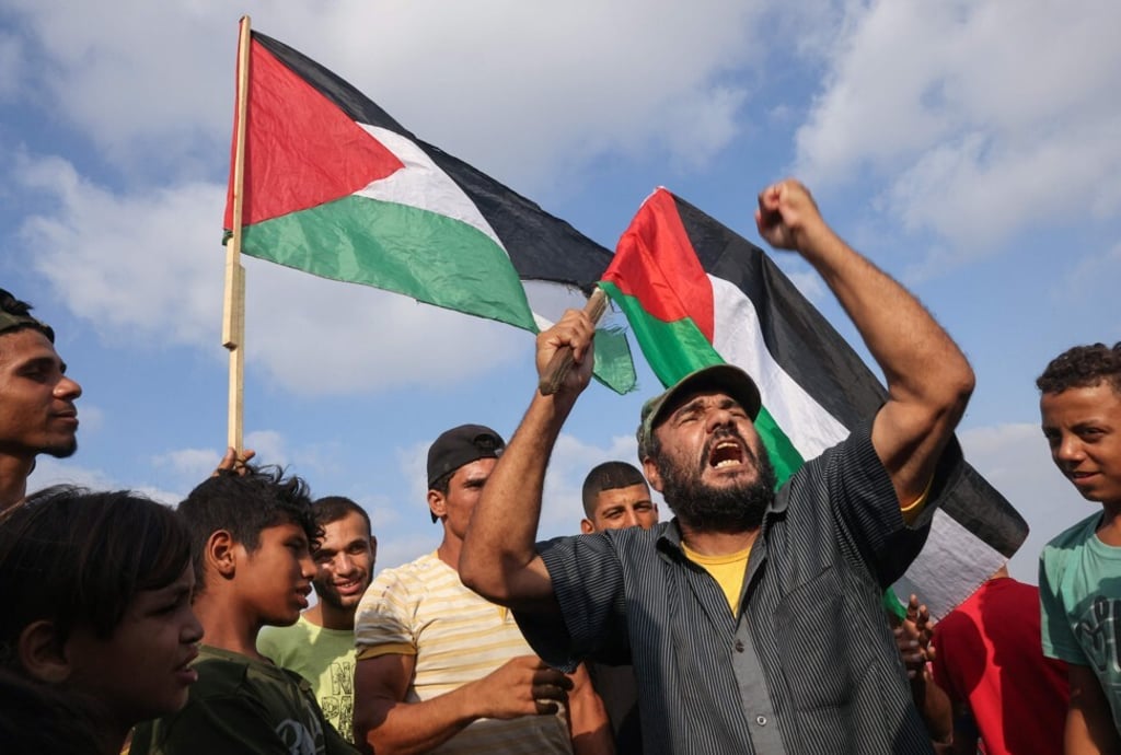 Palestinian protesters during a demonstration by the border fence with Israel, east of Gaza City on Saturday. Photo: AFP