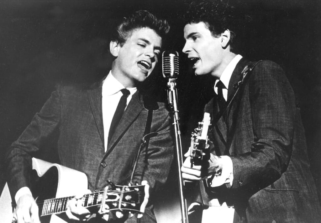 The Everly Brothers, Phil, left, and Don, perform on stage in 1964. Photo: AP