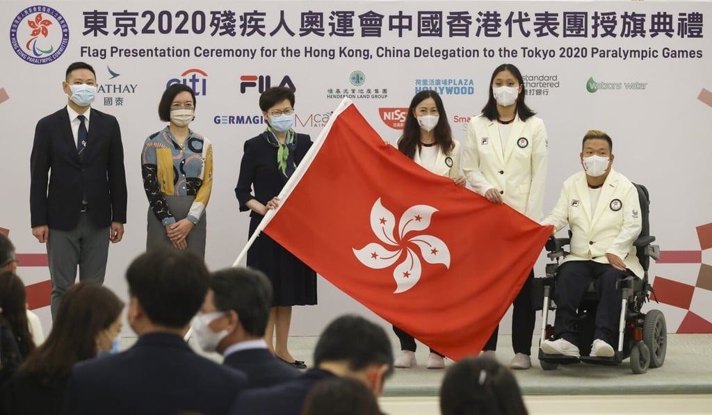 Hong Kong Chief Executive Carrie Lam Cheng Yuet-ngor presents the city flag to Wu Siu-ling, Chef de Mission of Hong Kong’s delegation to the Tokyo 2020 Paralympic Games. Photo: May Tse Hong Kong Chief Executive Carrie Lam Cheng Yuet-ngor presents the city flag to Wu Siu-ling, Chef de Mission of Hong Kong’s delegation to the Tokyo 2020 Paralympic Games. Photo: May Tse