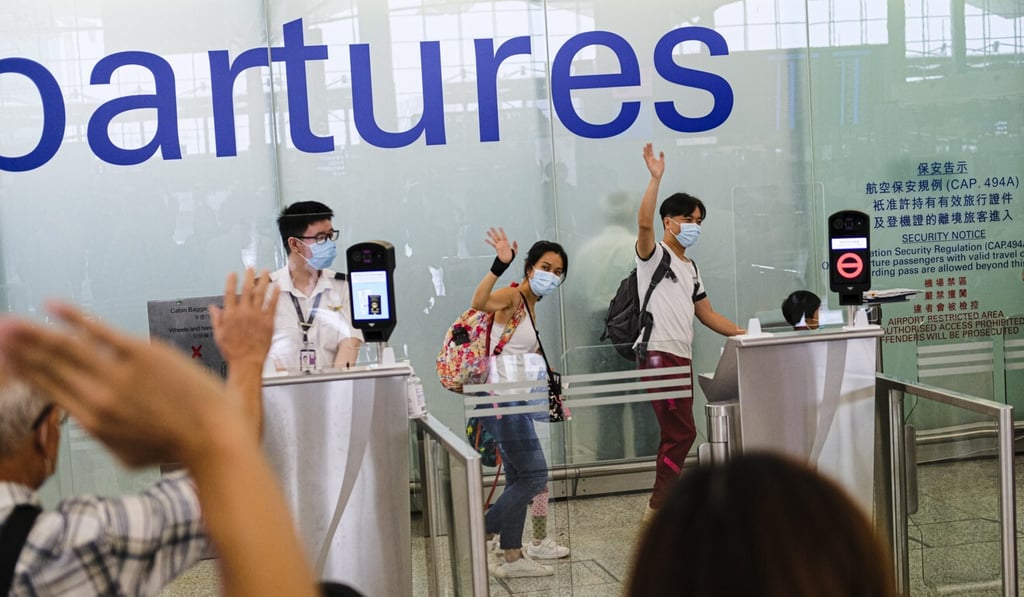 People waving goodbye at Hong Kong international airport in July. Thousands of Hongkongers have been leaving the city to settle in the United Kingdom. Photo: Getty Images People waving goodbye at Hong Kong international airport in July. Thousands of Hongkongers have been leaving the city to settle in the United Kingdom. Photo: Getty Images
