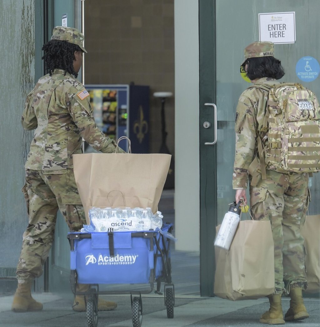 Members of the National Guard enter the New Orleans Ernest N Morial Convention Centre which is being set up as a shelter before the arrival of Hurricane Ida in New Orleans, Louisiana on Saturday. Photo: The Times-Picayune / The Advocate via AP