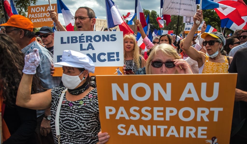 Protesters march in opposition to France’s health pass system in Paris on August 21. Photo: EPA-EFE