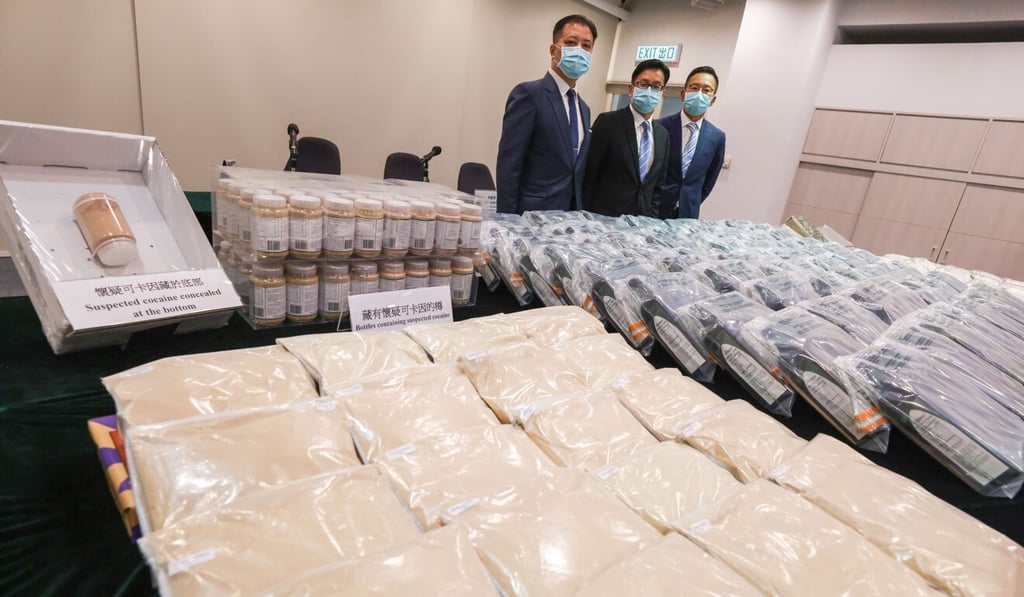 Customs Divisional Commander Philip Chan (left) poses with seized drugs, including about 72kg of cocaine, at a press conference in July. Photo: Nora Tam Customs Divisional Commander Philip Chan (left) poses with seized drugs, including about 72kg of cocaine, at a press conference in July. Photo: Nora Tam