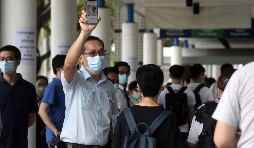 A security guard asks students and staff for their proof of vaccination or Covid-19 testing at the University of Science and Technology on Wednesday. Photo: Xiaomei Chen