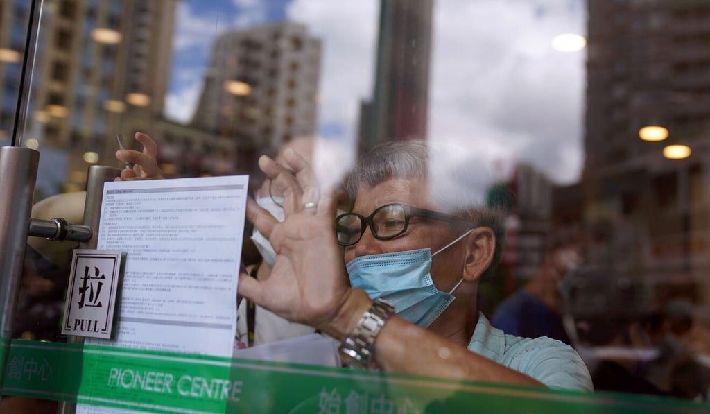 Hong Kong residents fill out their applications for the city’s e-voucher scheme on Thursday at Mong Kok’s Pioneer Centre. Photo: Sam Tsang