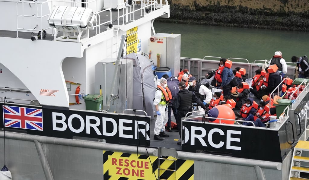 People thought to be migrants are brought into port after being picked up in the English Channel by a British border force vessel last month. Photo: AP