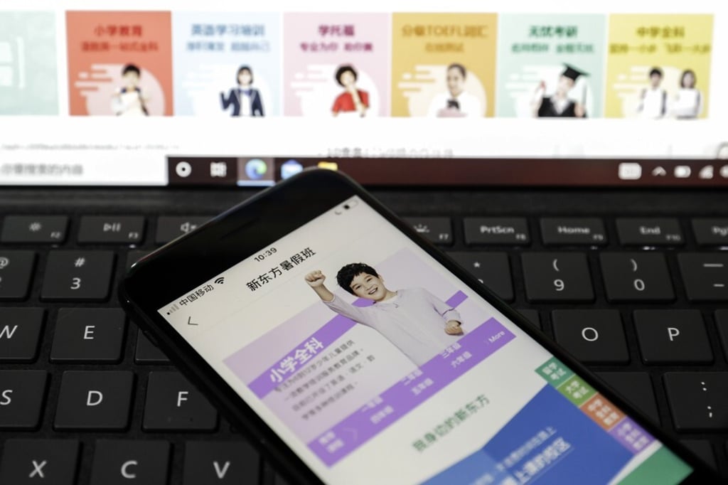 The New Oriental Education application featuring elementary school summer packages arranged on a smartphone in Shanghai on July 27. New Oriental was a darling of the private tutoring industry until a crackdown from Chinese regulators sent its stock price plummeting. Photo: Bloomberg