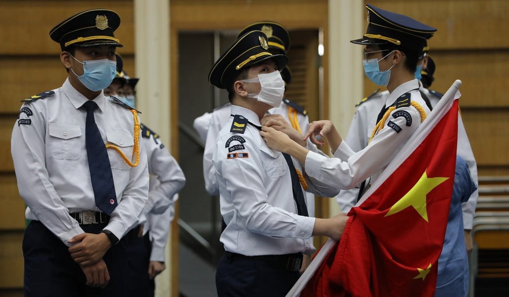 Pupils and staff prepare for a flag-raising ceremony at a Hong Kong school. Photo: May Tse