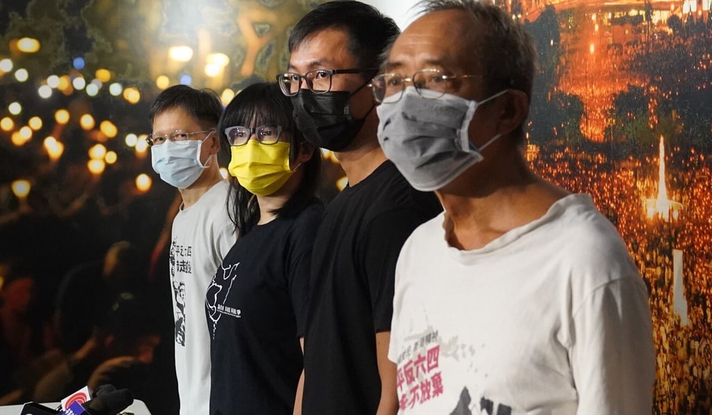 Alliance vice-chairwoman Chow Hang-tung (yellow mask) speaks to the press at the June 4 museum in Mong Kok on Sunday. Photo: Sam Tsang