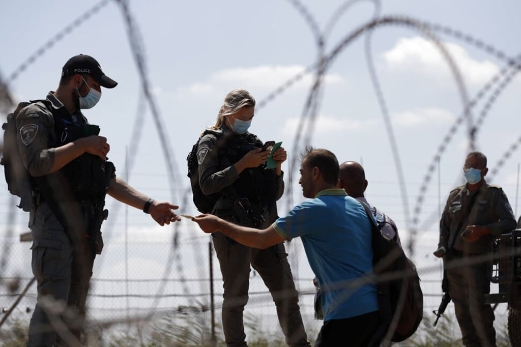 Israeli security forces check Palestinians’ IDs after prisoners escaped from Gilboa prison north of the West Bank on Monday. Photo: EPA-EFE