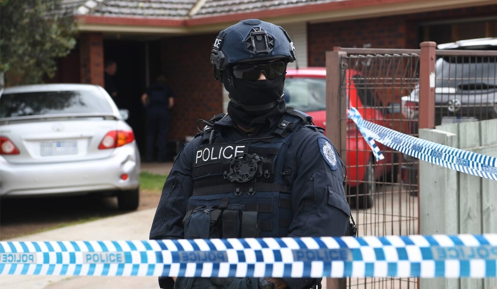 Police officers stand guard outside a property amid counterterrorism raids in Melbourne on November 9, 2018. File photo: EPA-EFE Police officers stand guard outside a property amid counterterrorism raids in Melbourne on November 9, 2018. File photo: EPA-EFE
