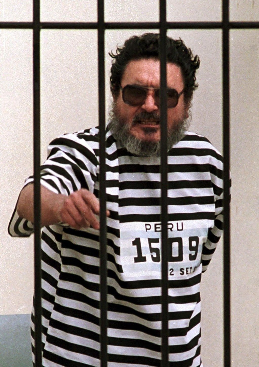Abimael Guzman behind bars in Lima, Peru in 1992. Photo: AFP Abimael Guzman behind bars in Lima, Peru in 1992. Photo: AFP