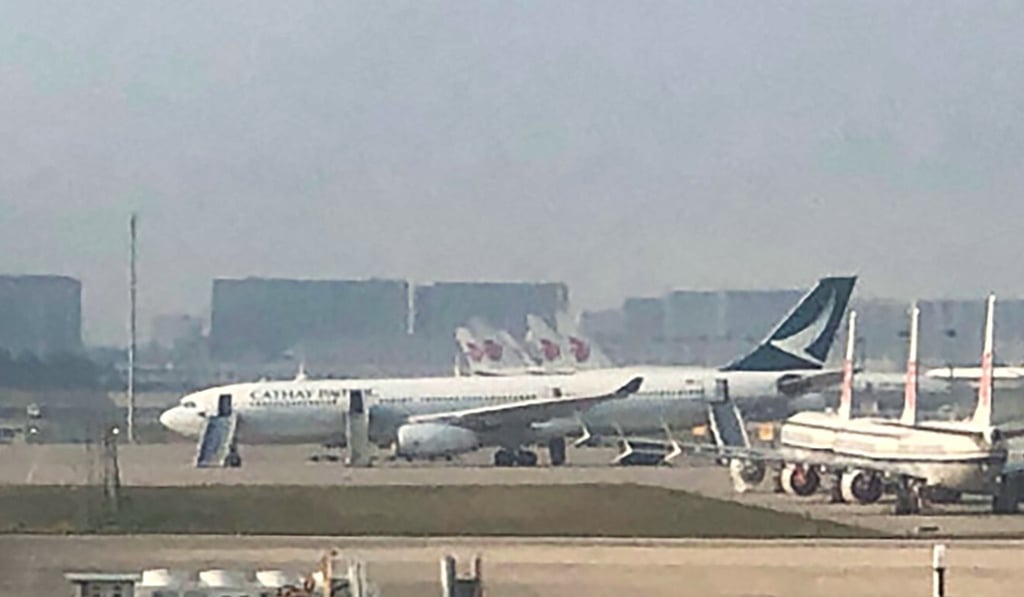 A photo shows the plane on the tarmac in Beijing with its emergency slides deployed. Photo: Weibo