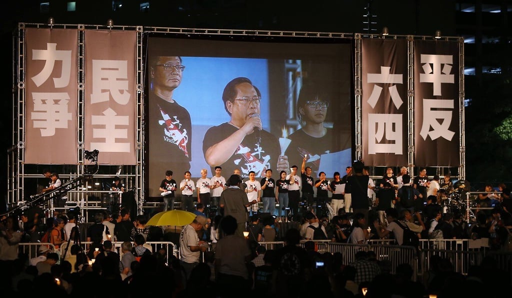 Albert Ho is shown a screen along with other members of the Hong Kong Alliance in Support of Patriotic Democratic Movements of China at Victoria Park on June 4, 2016. Photo: Sam Tsang Albert Ho is shown a screen along with other members of the Hong Kong Alliance in Support of Patriotic Democratic Movements of China at Victoria Park on June 4, 2016. Photo: Sam Tsang